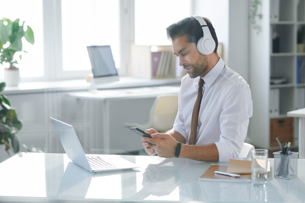 elegant office worker in headphones looking throug 2023 11 27 05 21 42 utc Easy Resize.com